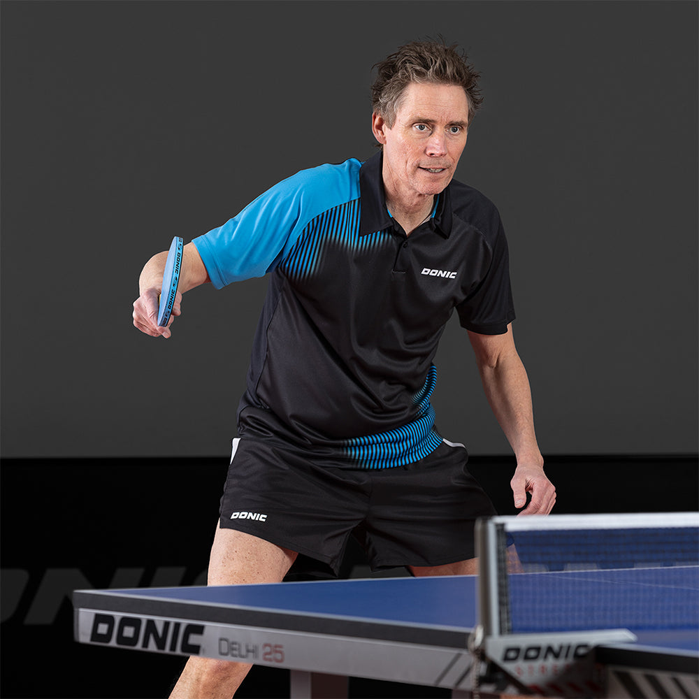 Donic Polo Caliber Noir/Cyan